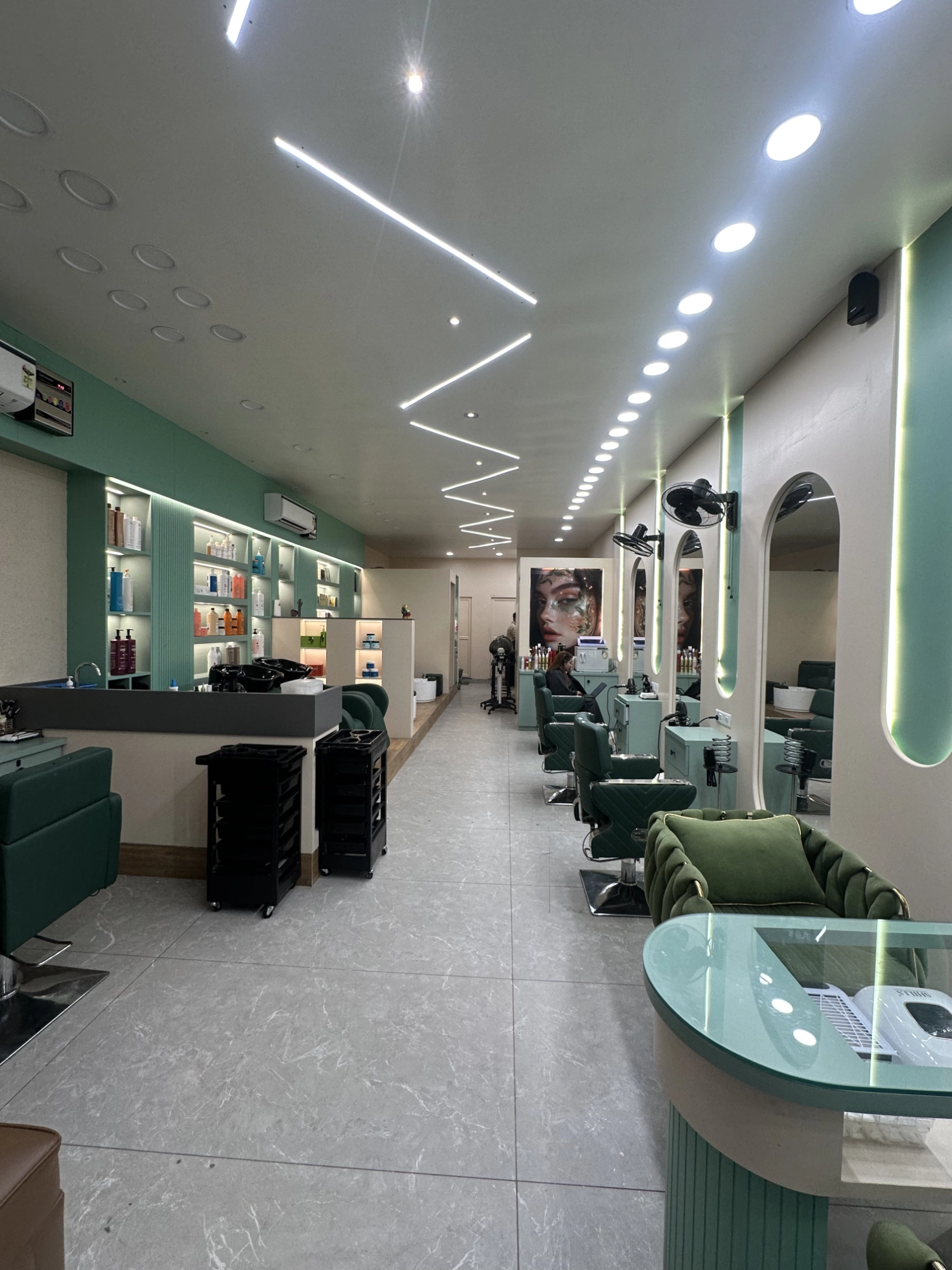 Interior of Iconik Salon Hisar showcasing a modern, stylish setup with premium styling stations, mirrors, and seating in a luxury unisex salon in Hisar, designed for comfort, hygiene, and a professional beauty experience.